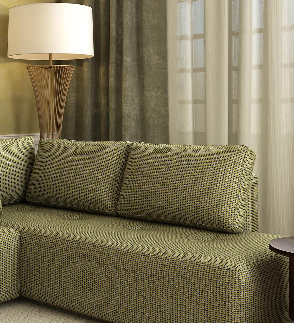 Elegant upholstered seating with layered curtains and warm interior styling